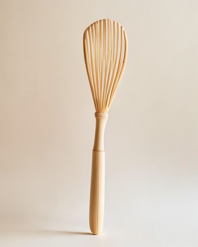 A single handmade white bamboo tea whisk